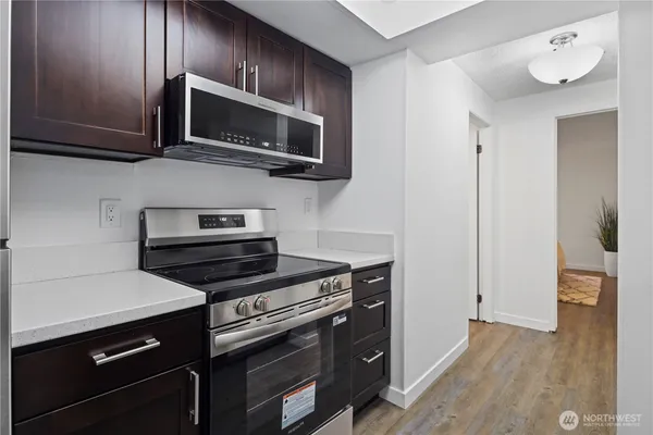 a kitchen with a sink and a refrigerator