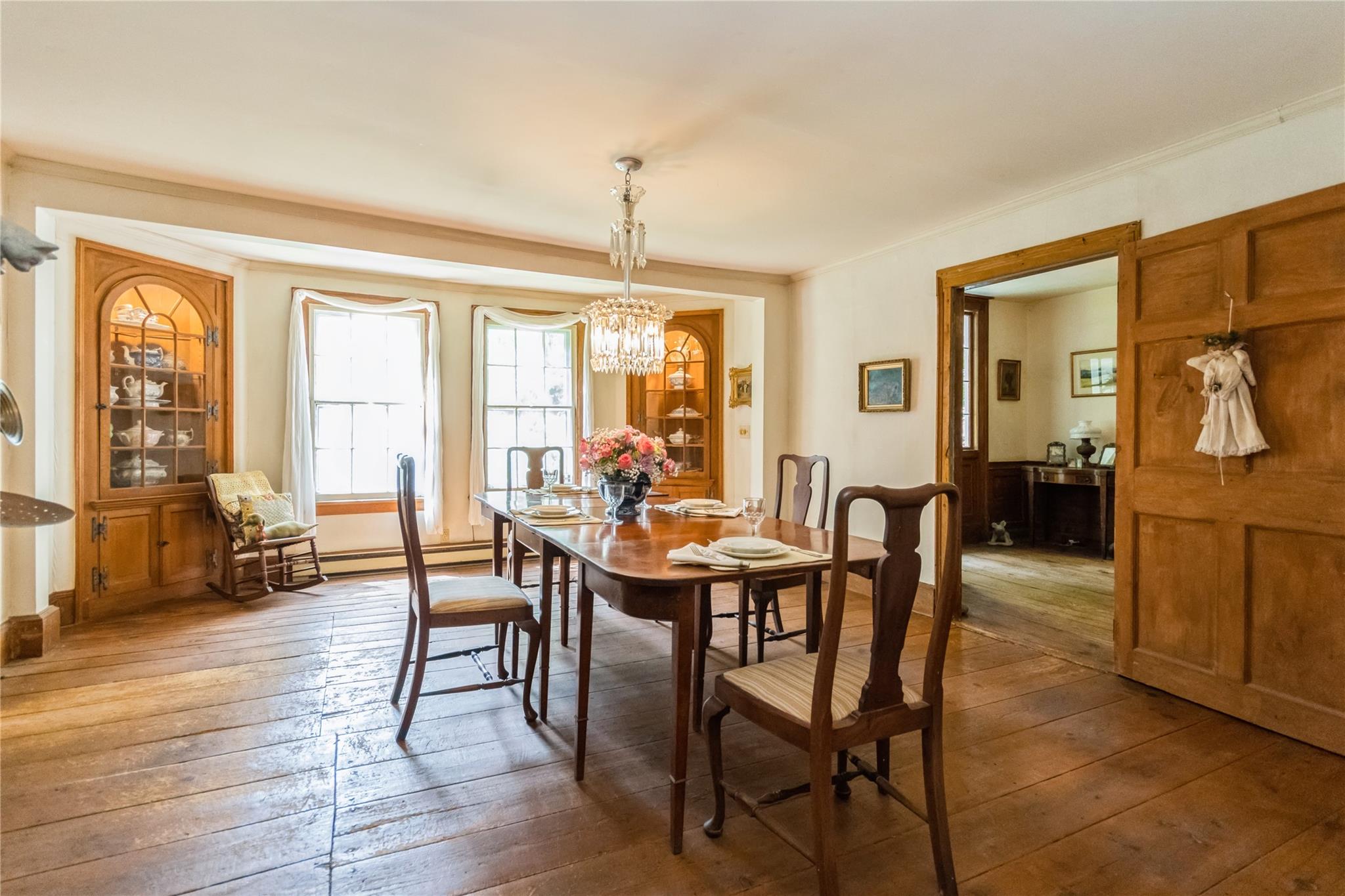 93 Widmer Road Wappingers Falls, NY 12590 - Photo 12 of 45 a view of a dining room with furniture window and wooden floor
