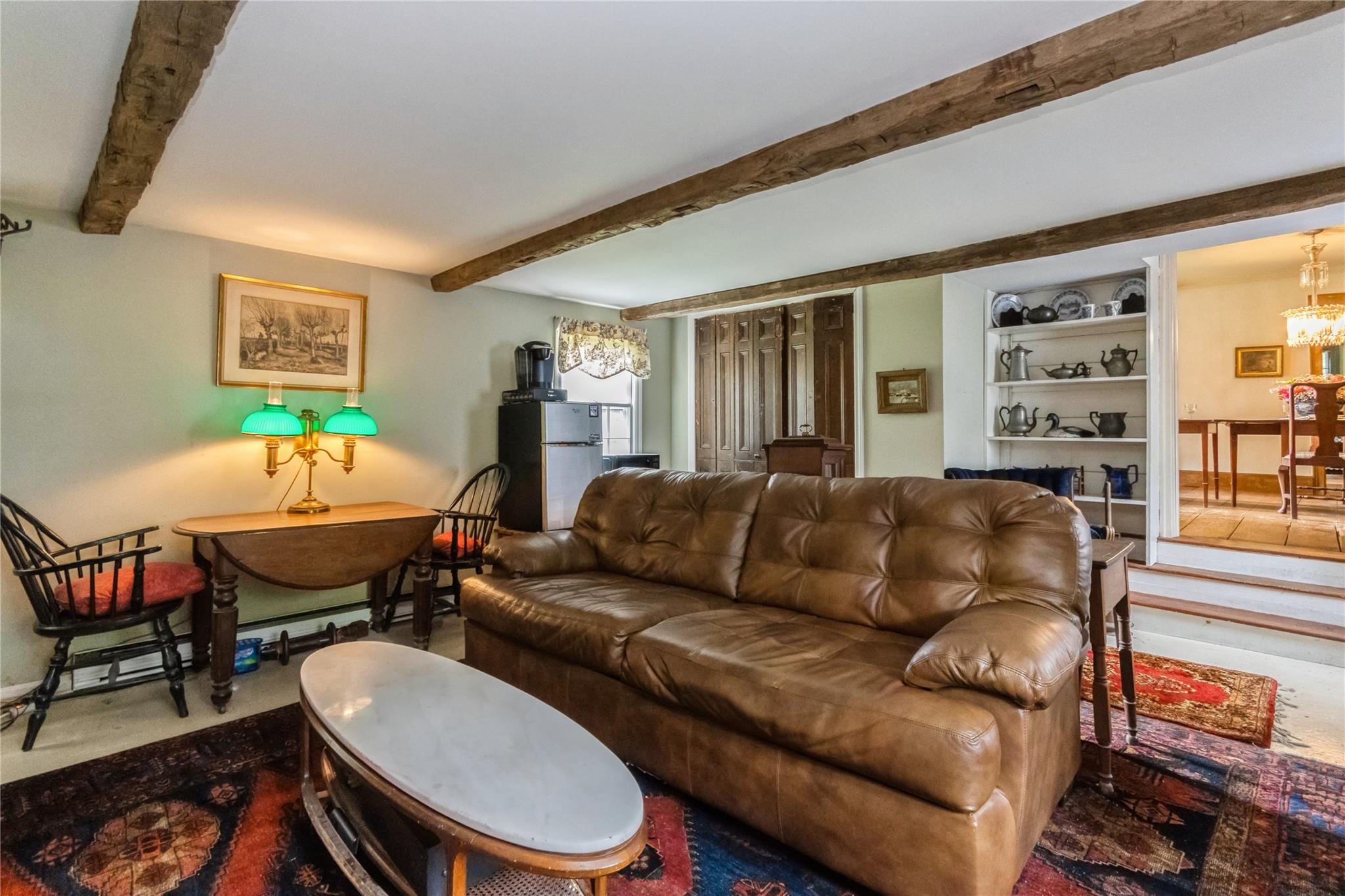 93 Widmer Road Wappingers Falls, NY 12590 - Photo 23 of 45 a living room with furniture a large window and a table