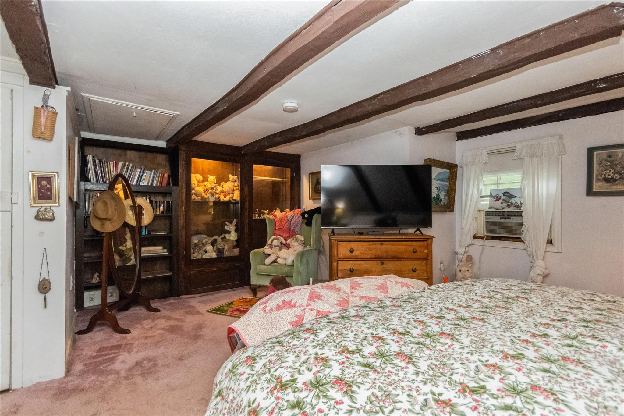 93 Widmer Road Wappingers Falls, NY 12590 - Photo 32 of 45 a bedroom with a bed and a flat screen tv in the kitchen