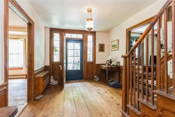 a view of livingroom with furniture wooden floor and windows