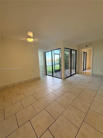 a kitchen with stainless steel appliances a refrigerator sink and cabinets