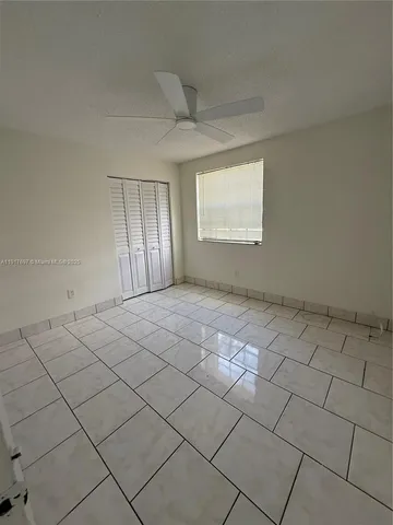 a bathroom with a toilet and bathtub