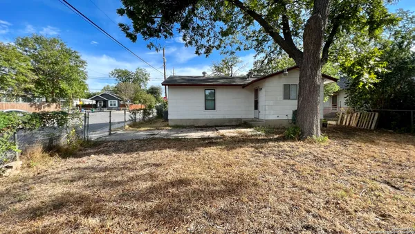 a view of a couches under an umbrella