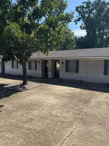 a house with trees in front of it