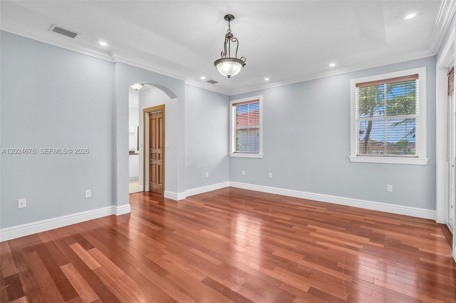 2155 Southwest 156th Court Miami, FL 33185 - Photo 39 of 57 a view of an empty room with wooden floor and a window