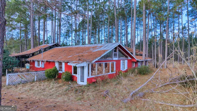 a spacious bathroom with a granite countertop tub and a large window