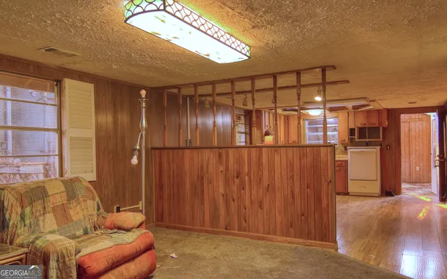 a view of a hallway with wooden shelves