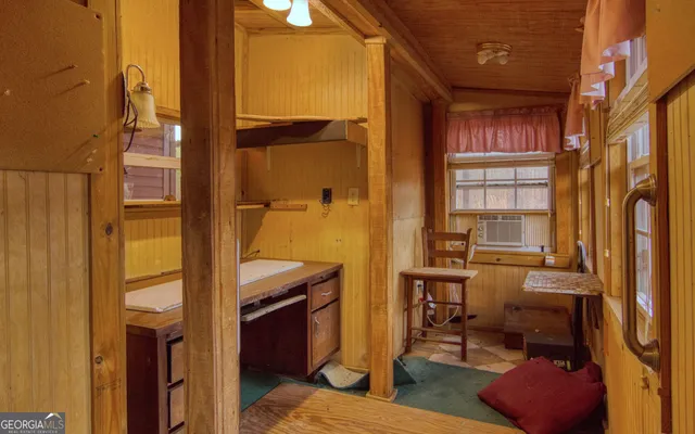 a kitchen with a stove a refrigerator and a sink