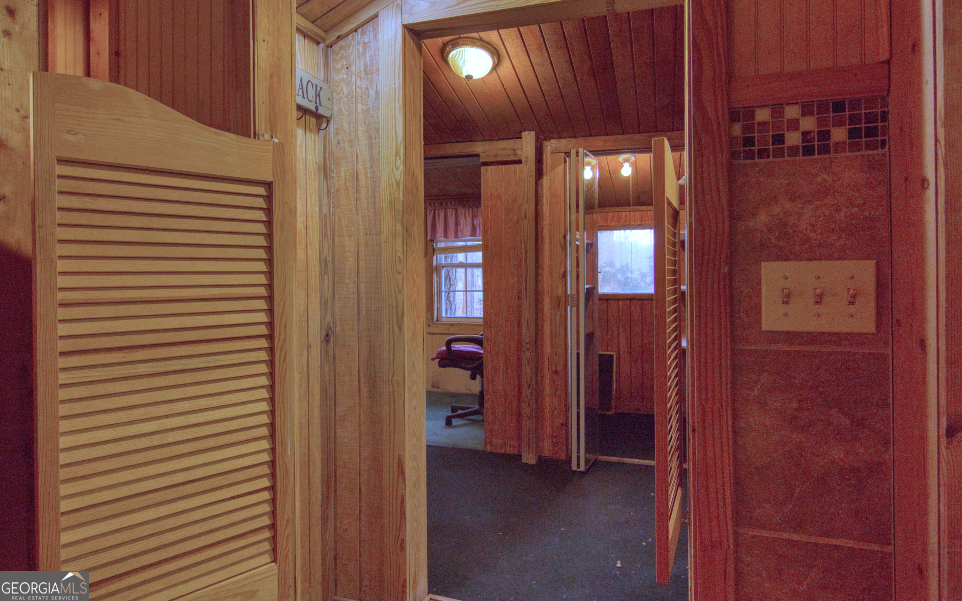 4421 Albert Rahn Road Glennville, GA 30427 - Photo 48 of 73 a view of a hallway with wooden shelves