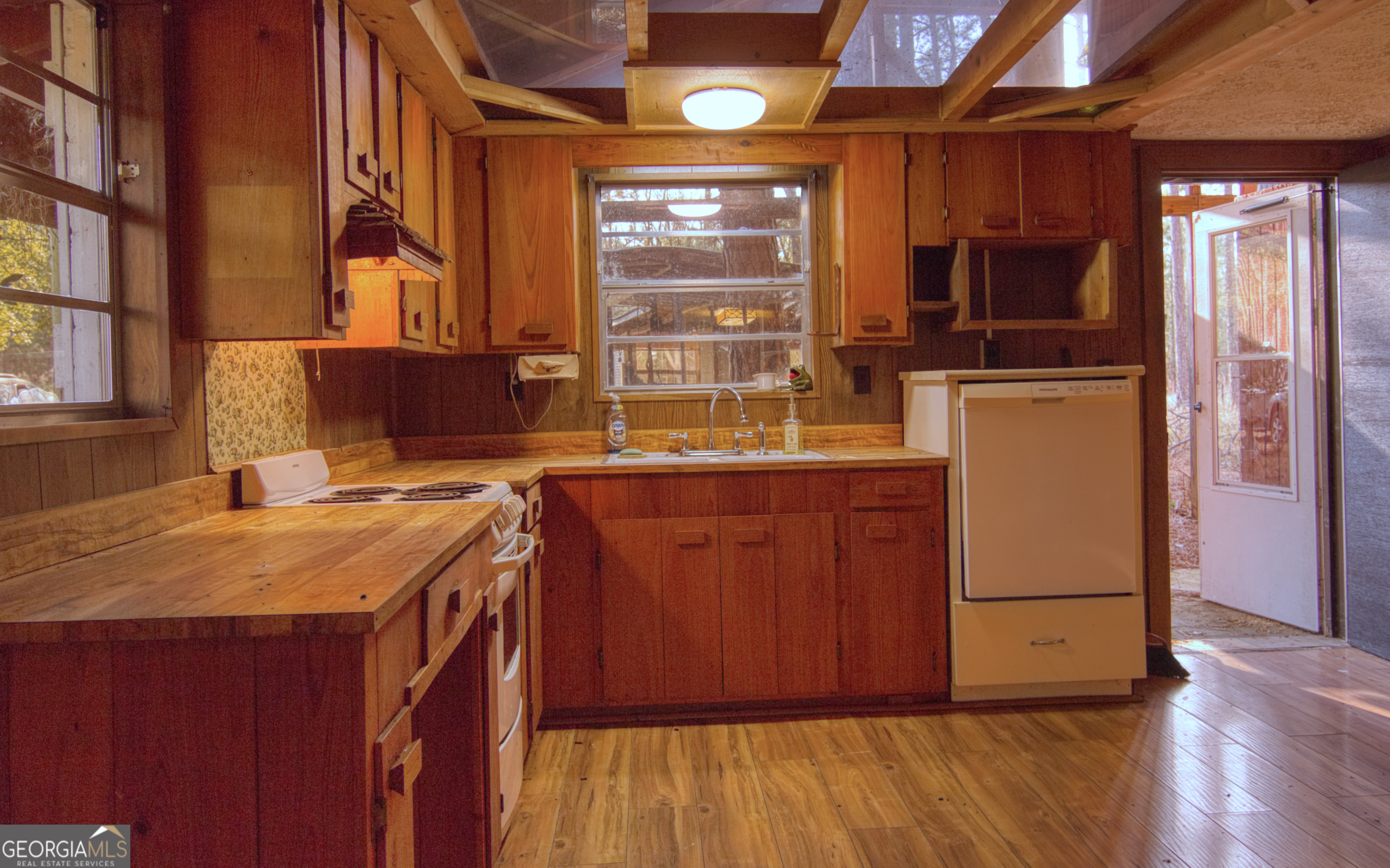 4421 Albert Rahn Road Glennville, GA 30427 - Photo 56 of 73 a kitchen with a refrigerator and a stove top oven