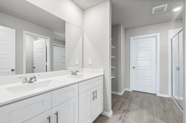 a view of hallway with wooden floor
