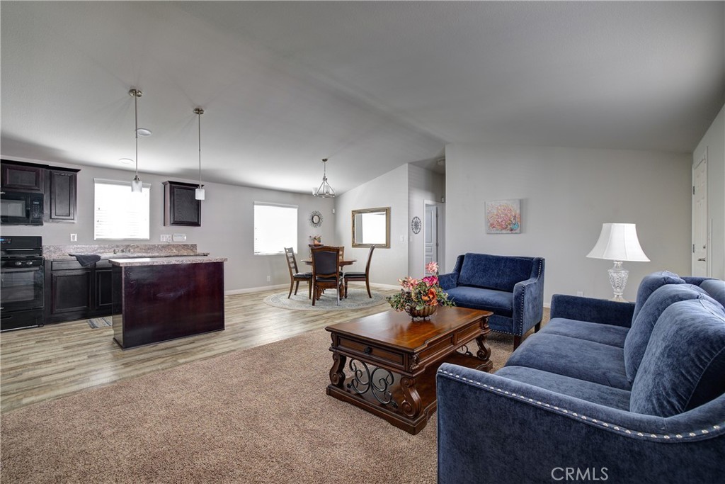 3700 Buchanan, Unit 25 Corona, CA 92503 - Photo 12 of 27 a living room with furniture and a flat screen tv