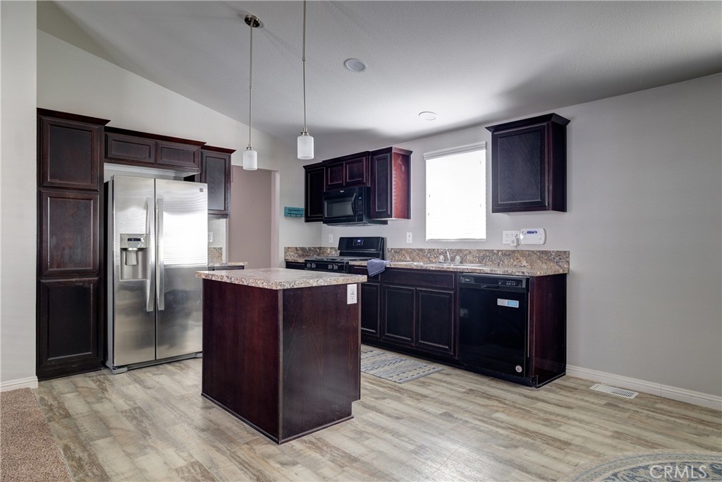 3700 Buchanan, Unit 25 Corona, CA 92503 - Photo 14 of 27 a kitchen with stainless steel appliances granite countertop a refrigerator and a stove