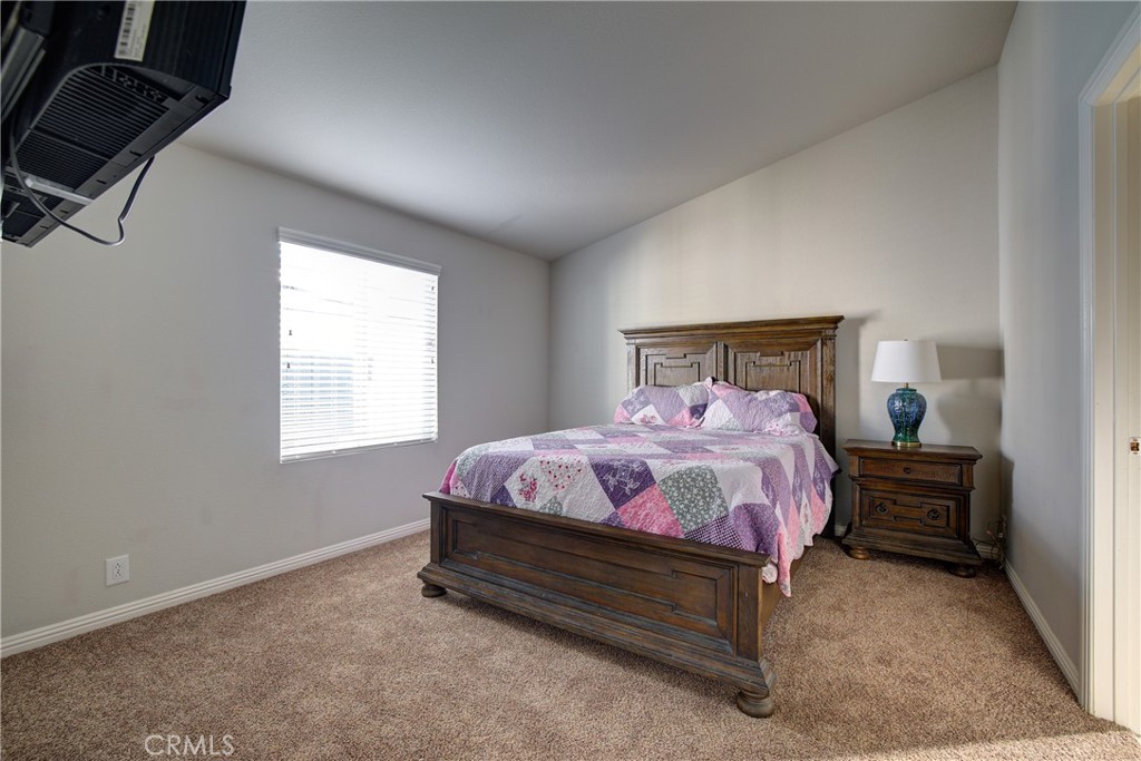 3700 Buchanan, Unit 25 Corona, CA 92503 - Photo 18 of 27 a bedroom with a bed and window
