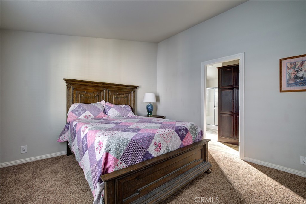 3700 Buchanan, Unit 25 Corona, CA 92503 - Photo 20 of 27 a bedroom with a bed and window