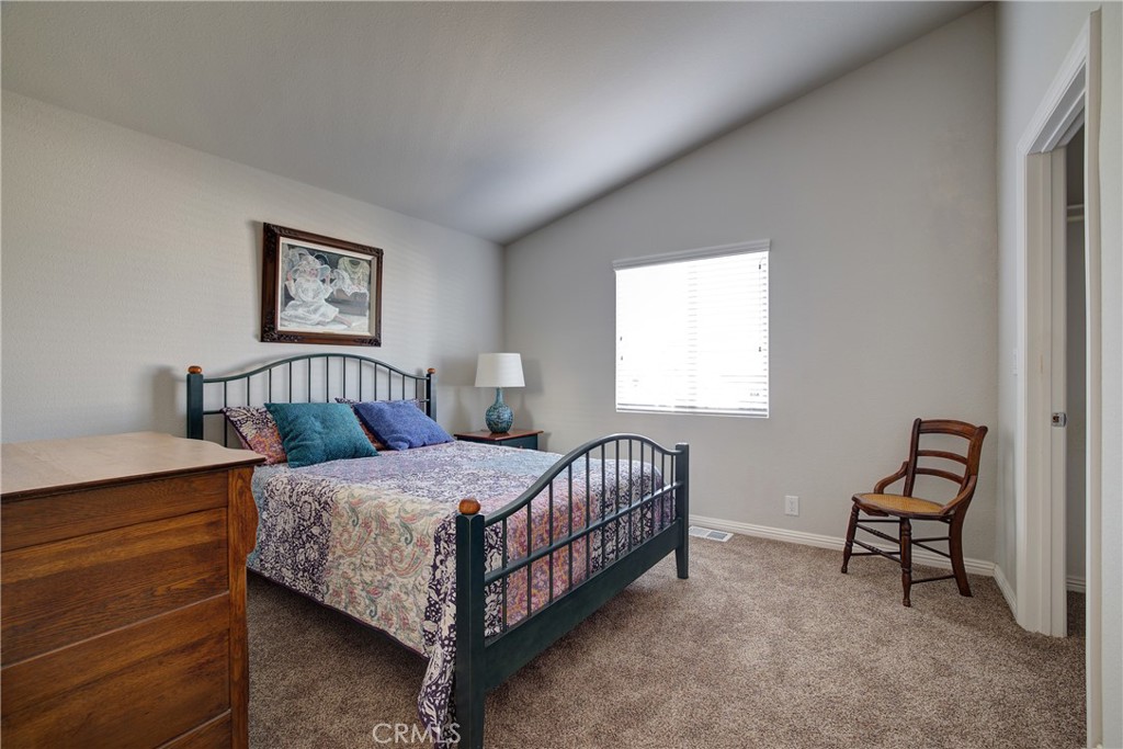 3700 Buchanan, Unit 25 Corona, CA 92503 - Photo 22 of 27 a bedroom with a bed and a window