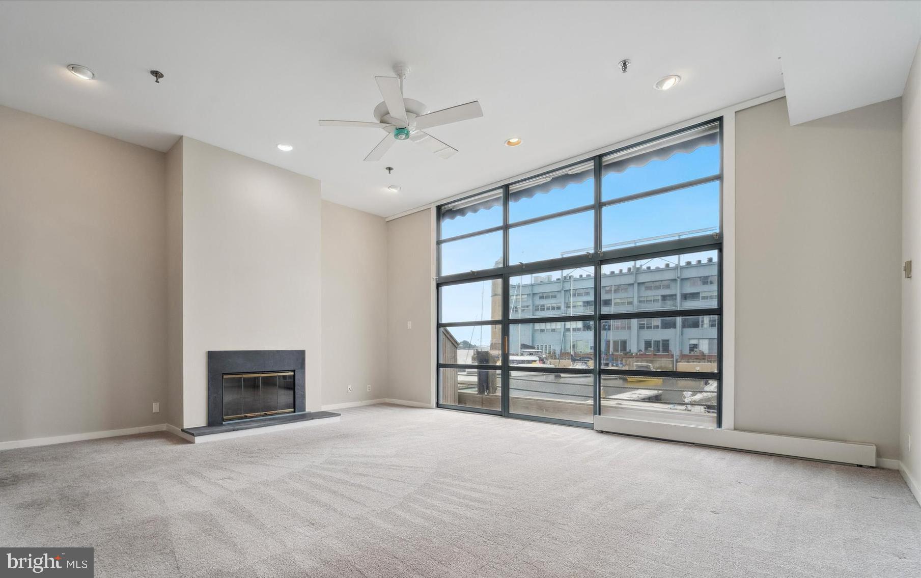 7 North Christopher Columbus Boulevard, Unit 130 Philadelphia, PA 19106 - Photo 9 of 44 Living room expansive windows, river view