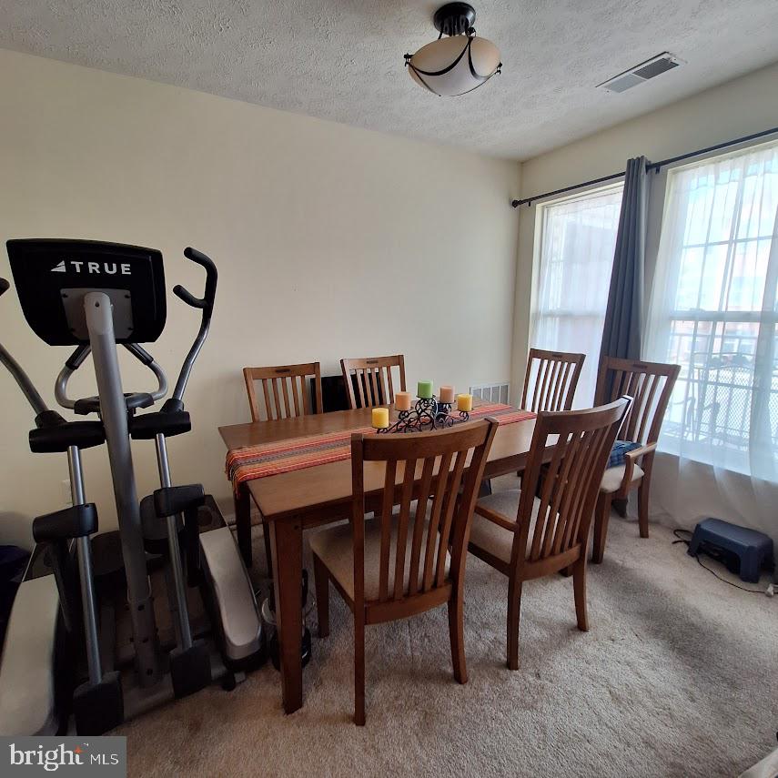 9609 Haven Farm Road, Unit 9609H Perry Hall, MD 21128 - Photo 8 of 21 Bright dining space with fitness touch.