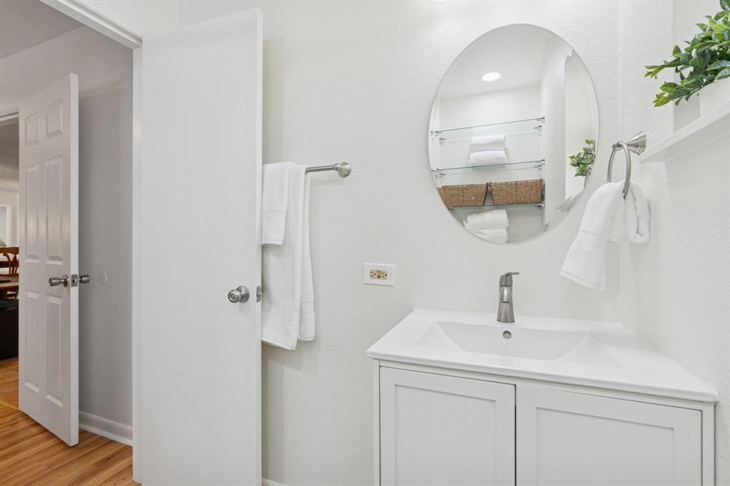 4001 Willow Bend Road Benbrook, TX 76116 - Photo 17 of 29 a bathroom with a sink and mirror