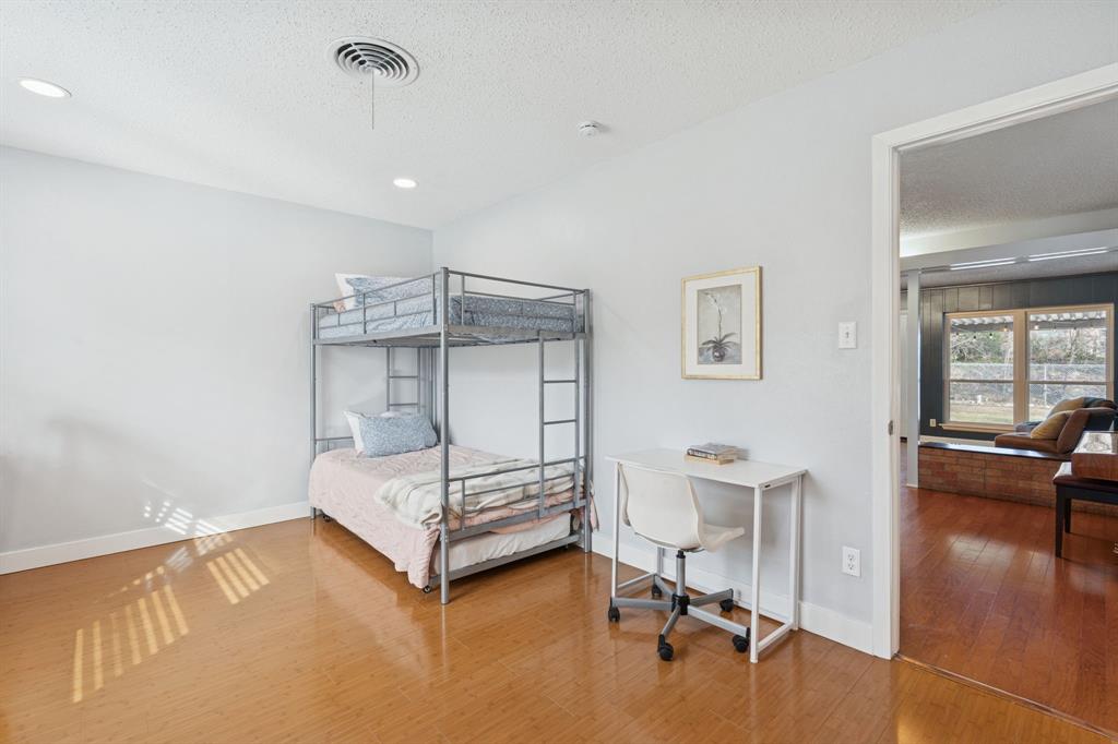 4001 Willow Bend Road Benbrook, TX 76116 - Photo 19 of 29 a bedroom with a bed and furniture