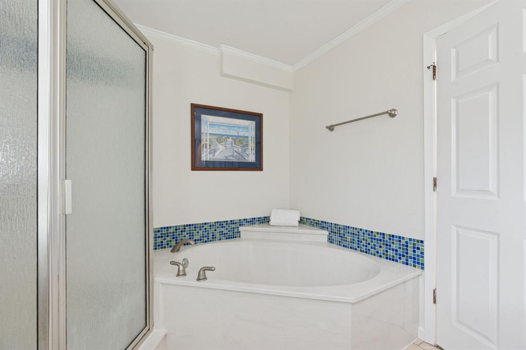 4001 Willow Bend Road Benbrook, TX 76116 - Photo 22 of 29 a bathroom with a bathtub and a shower
