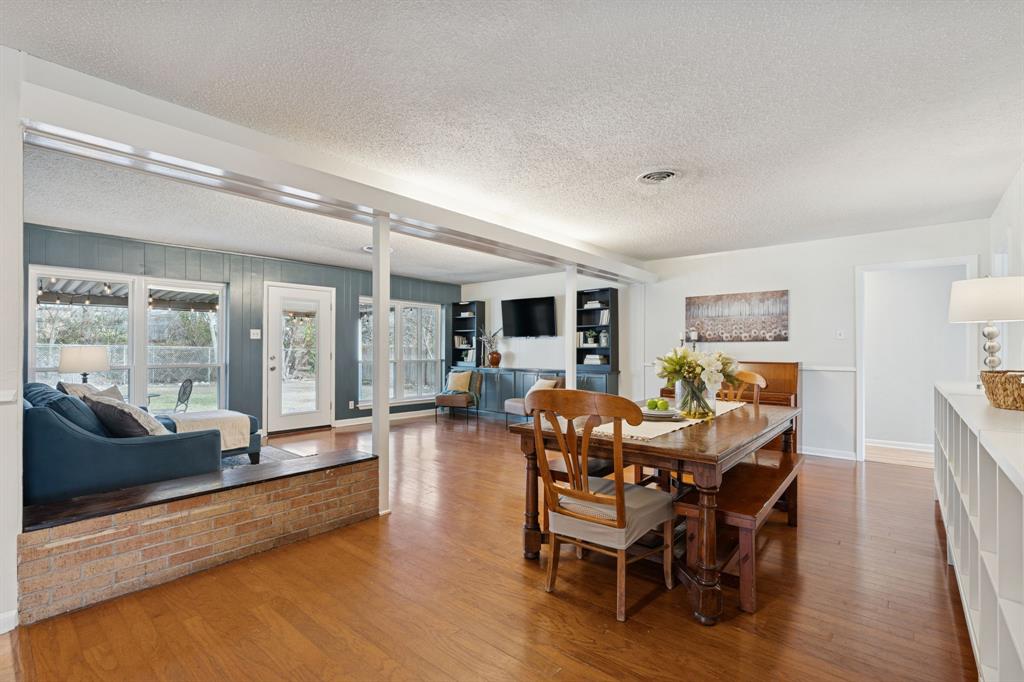 4001 Willow Bend Road Benbrook, TX 76116 - Photo 8 of 29 a view of a dining room with furniture window and wooden floor