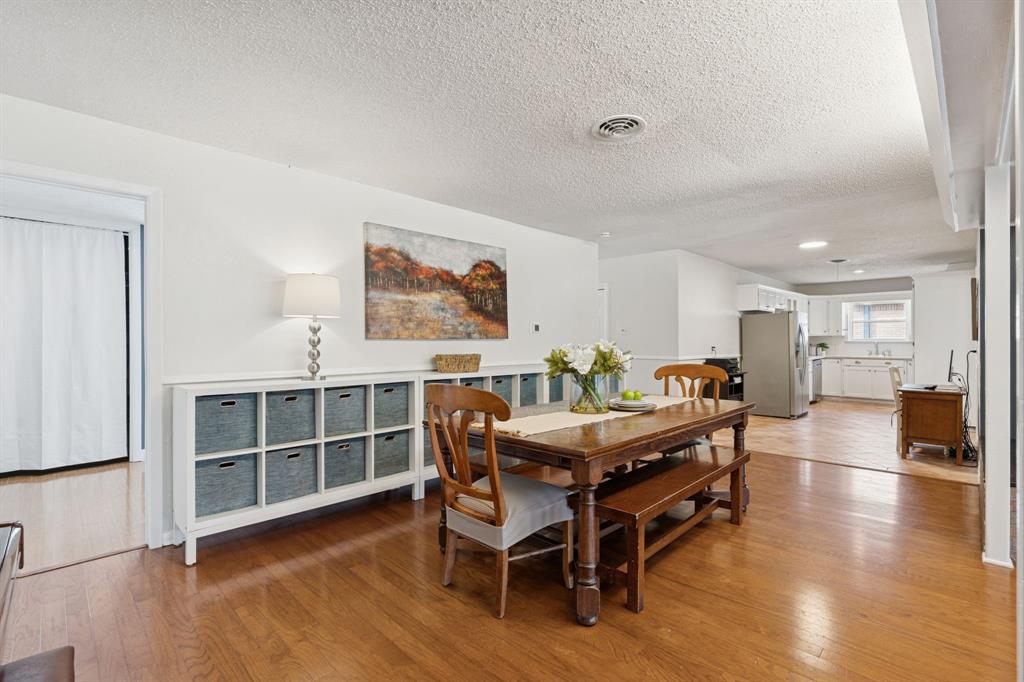 4001 Willow Bend Road Benbrook, TX 76116 - Photo 9 of 29 a view of a dining room with furniture and wooden floor