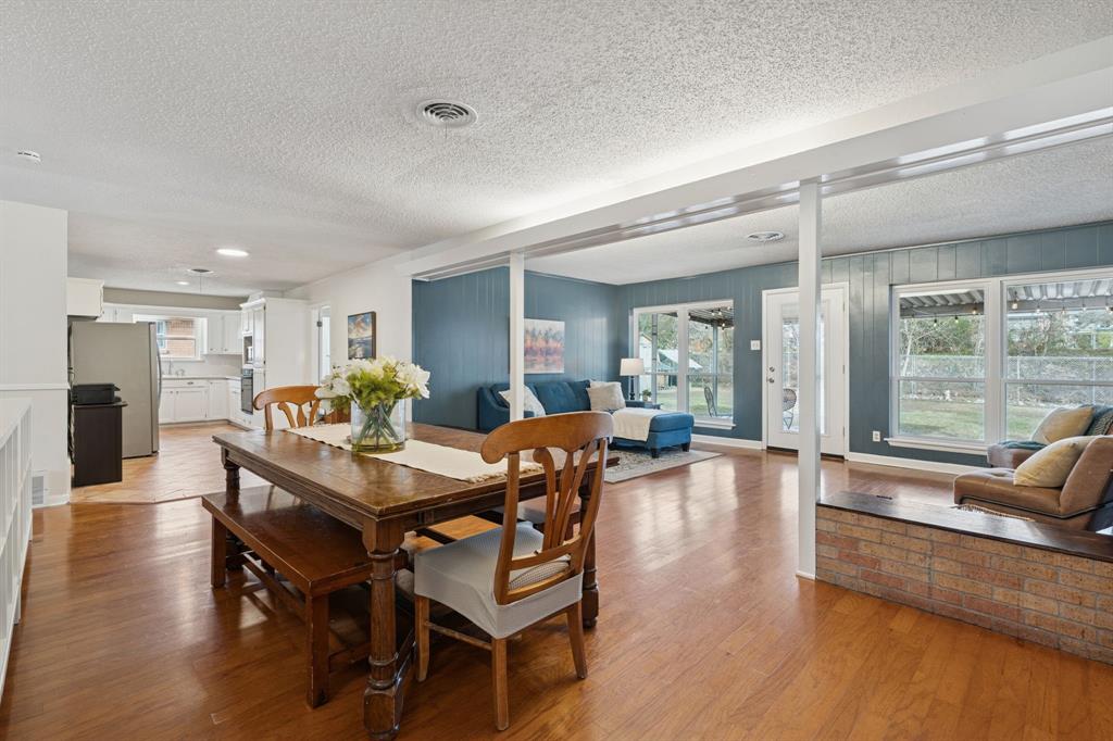 4001 Willow Bend Road Benbrook, TX 76116 - Photo 10 of 29 a view of a dining room with furniture window and wooden floor