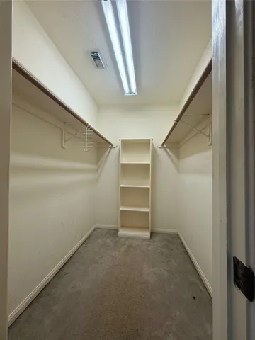 a spacious bathroom with a double vanity sink mirror and double