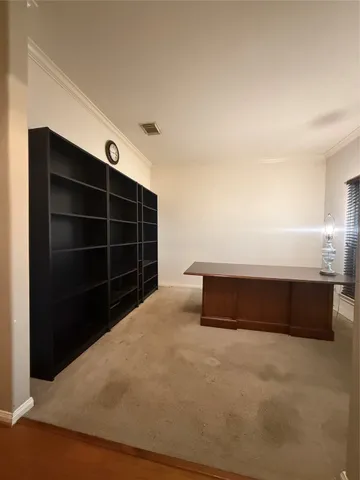a view of a livingroom with dining room and furniture