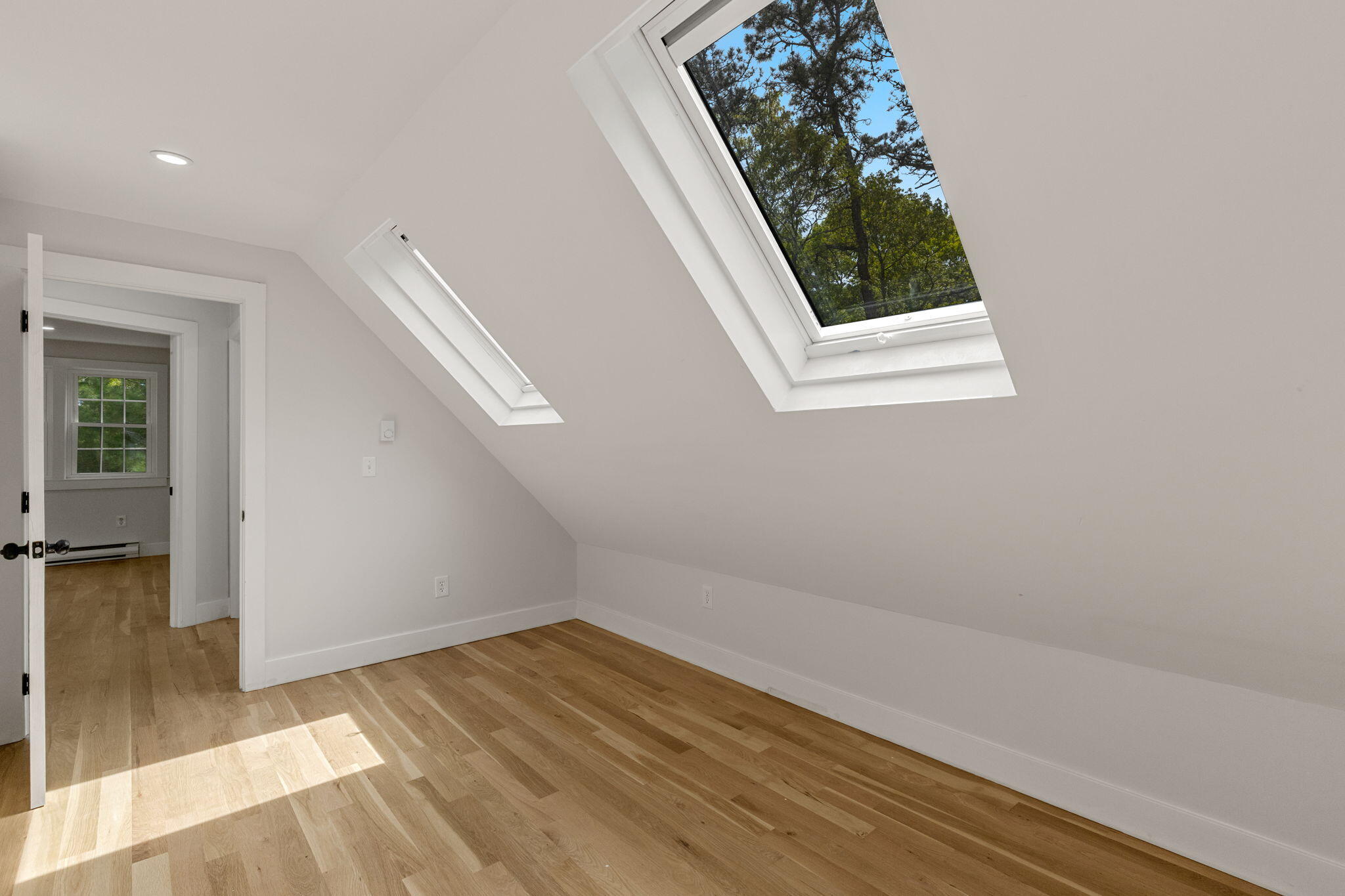 81 Sam Turner Road East Falmouth, MA 02536 - Photo 28 of 37 an empty room with wooden floor and windows
