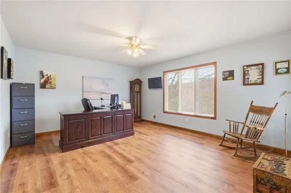 a bed room with a bed and a chair