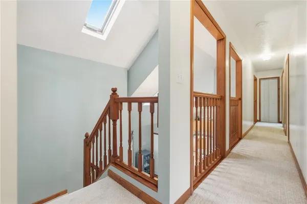 a view of a hallway with stairs