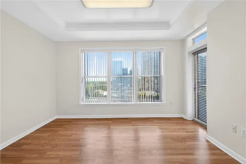 a view of a balcony with wooden floor