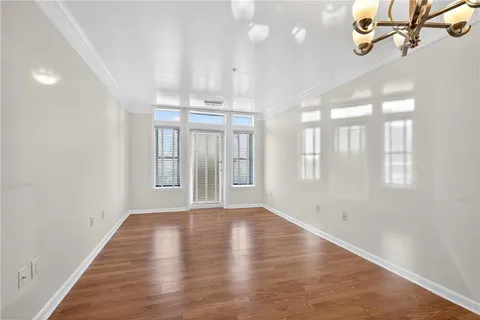 a kitchen with granite countertop a sink a stove and cabinets