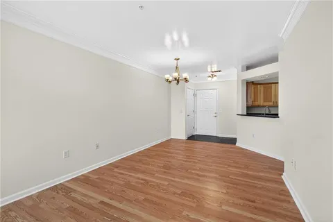 a bathroom with a granite countertop sink a toilet and a mirror