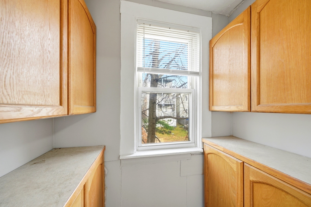29-31 Auburn Street, Unit 2L Everett, MA 02149 - Photo 5 of 18 a kitchen with a window and a kitchen
