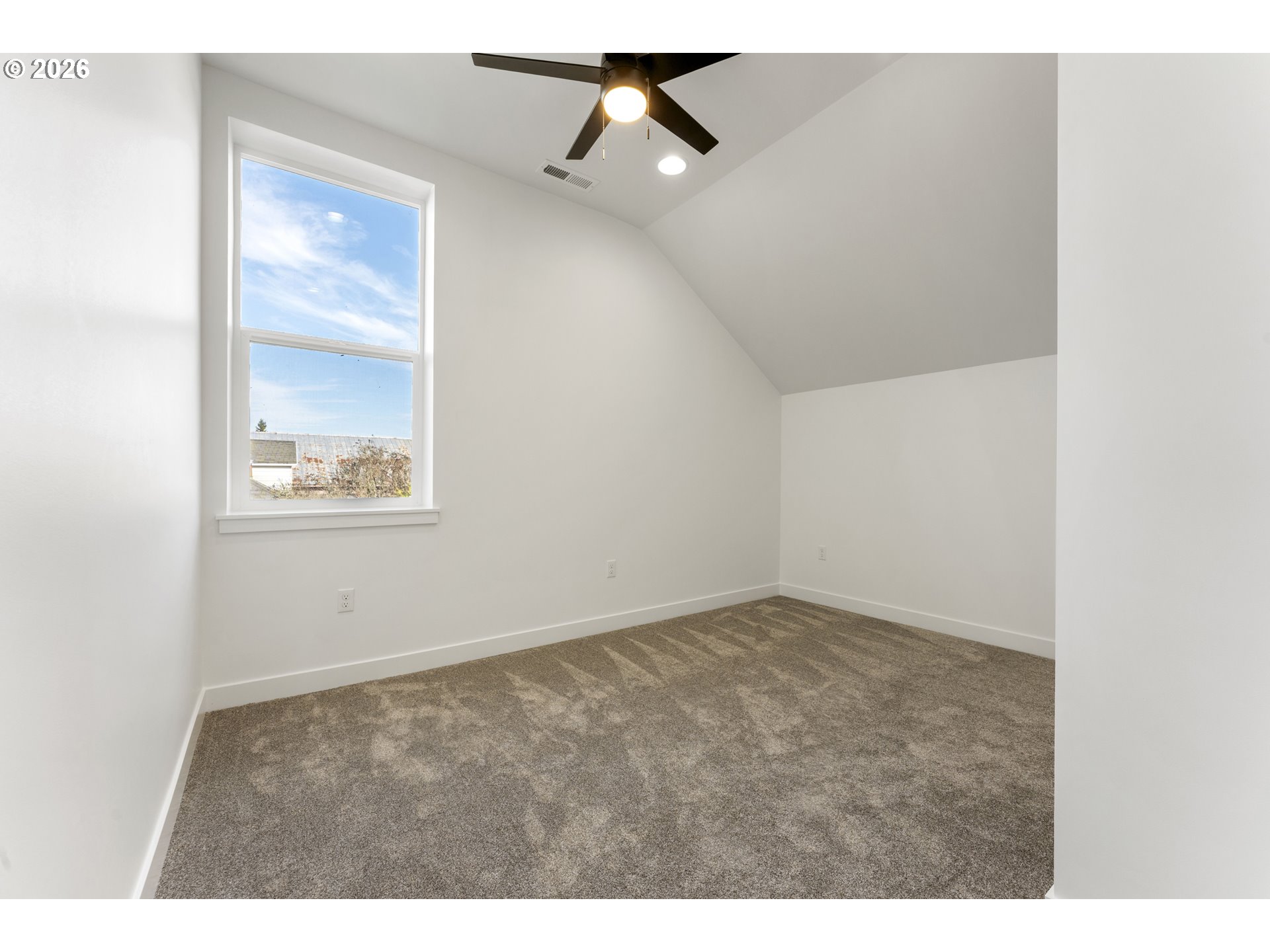 413 South Trade Street Amity, OR 97101 - Photo 27 of 42 an empty room with fan and windows