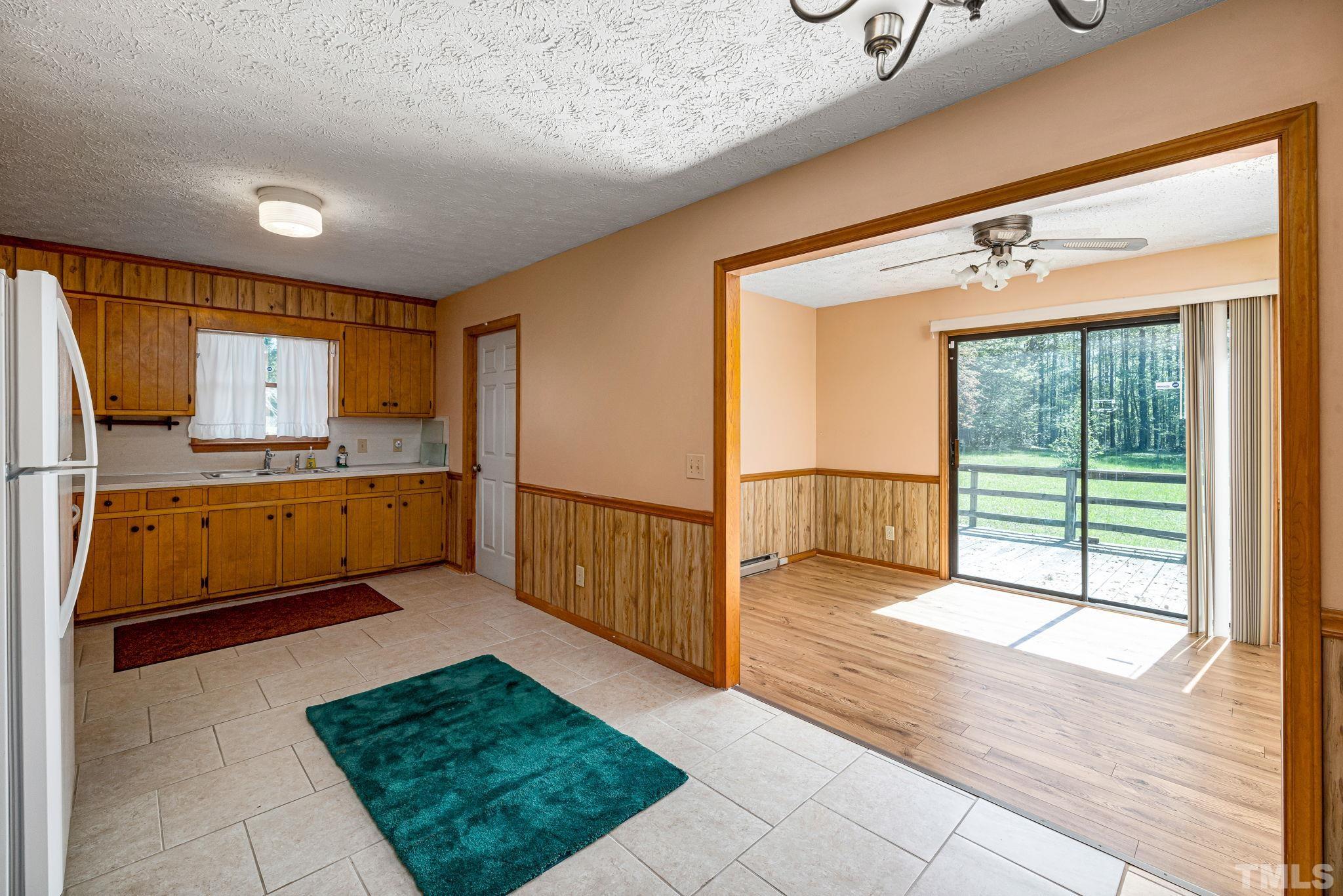 3509 Hurdle Mills Road Roxboro, NC 27574 - Photo 11 of 30 a view of a kitchen with a sink and a window