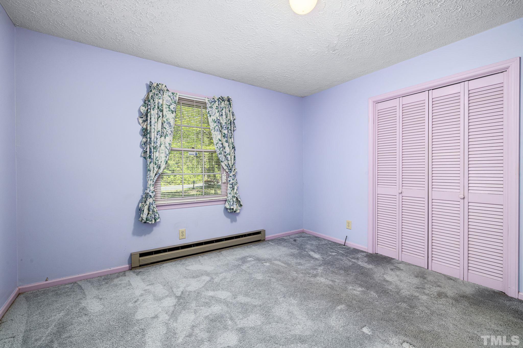 3509 Hurdle Mills Road Roxboro, NC 27574 - Photo 25 of 30 an empty room with window