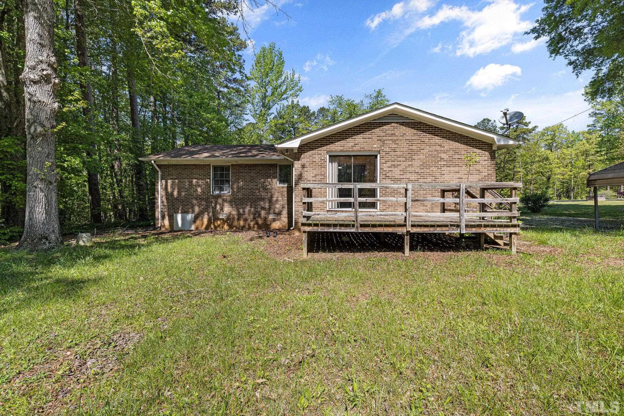 3509 Hurdle Mills Road Roxboro, NC 27574 - Photo 28 of 30 a view of a house with backyard and sitting area
