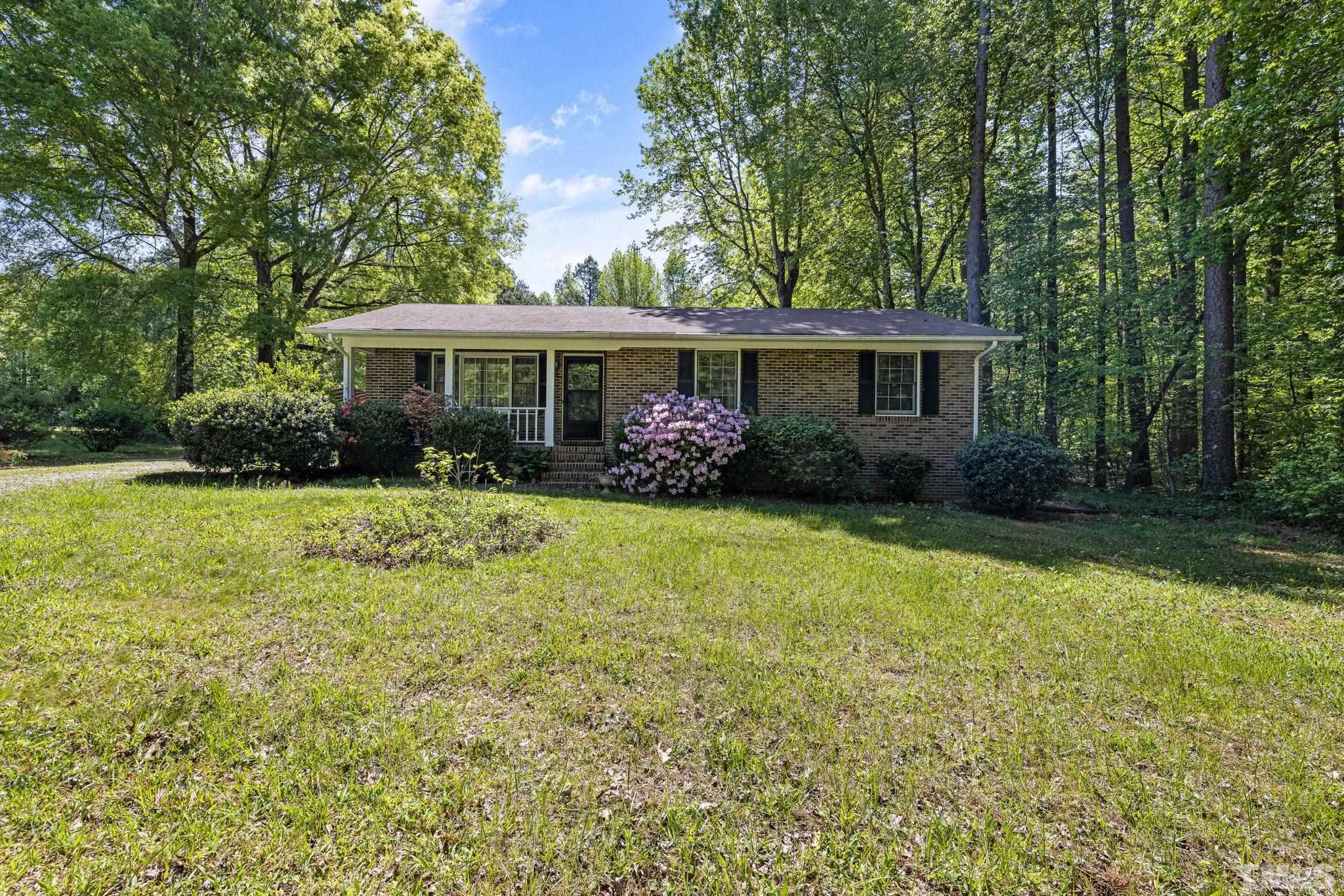 3509 Hurdle Mills Road Roxboro, NC 27574 - Photo 3 of 30 a front view of house with yard and green space