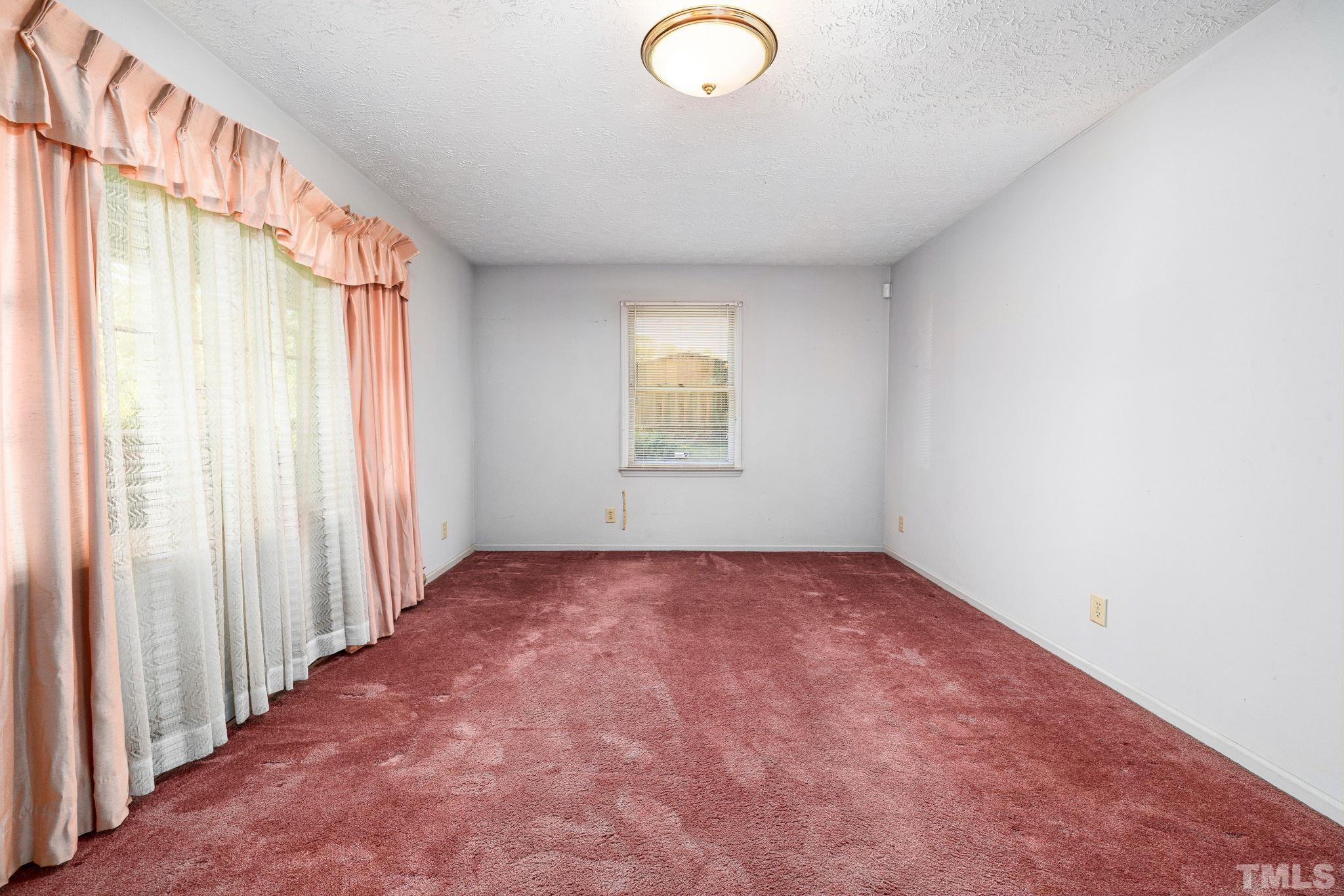 3509 Hurdle Mills Road Roxboro, NC 27574 - Photo 8 of 30 an empty room with a window
