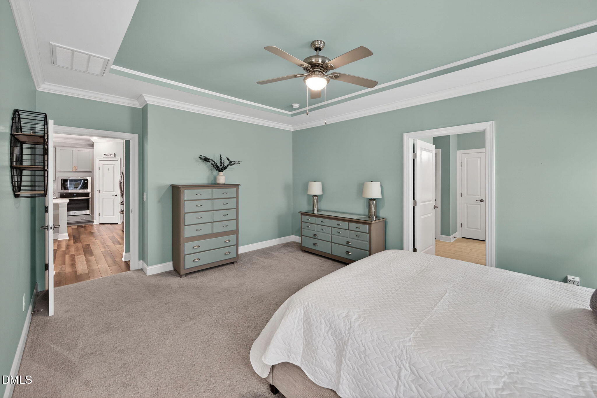 118 Mahogany Raleigh, NC 27610 - Photo 25 of 74 a spacious bedroom with a bed and a chandelier