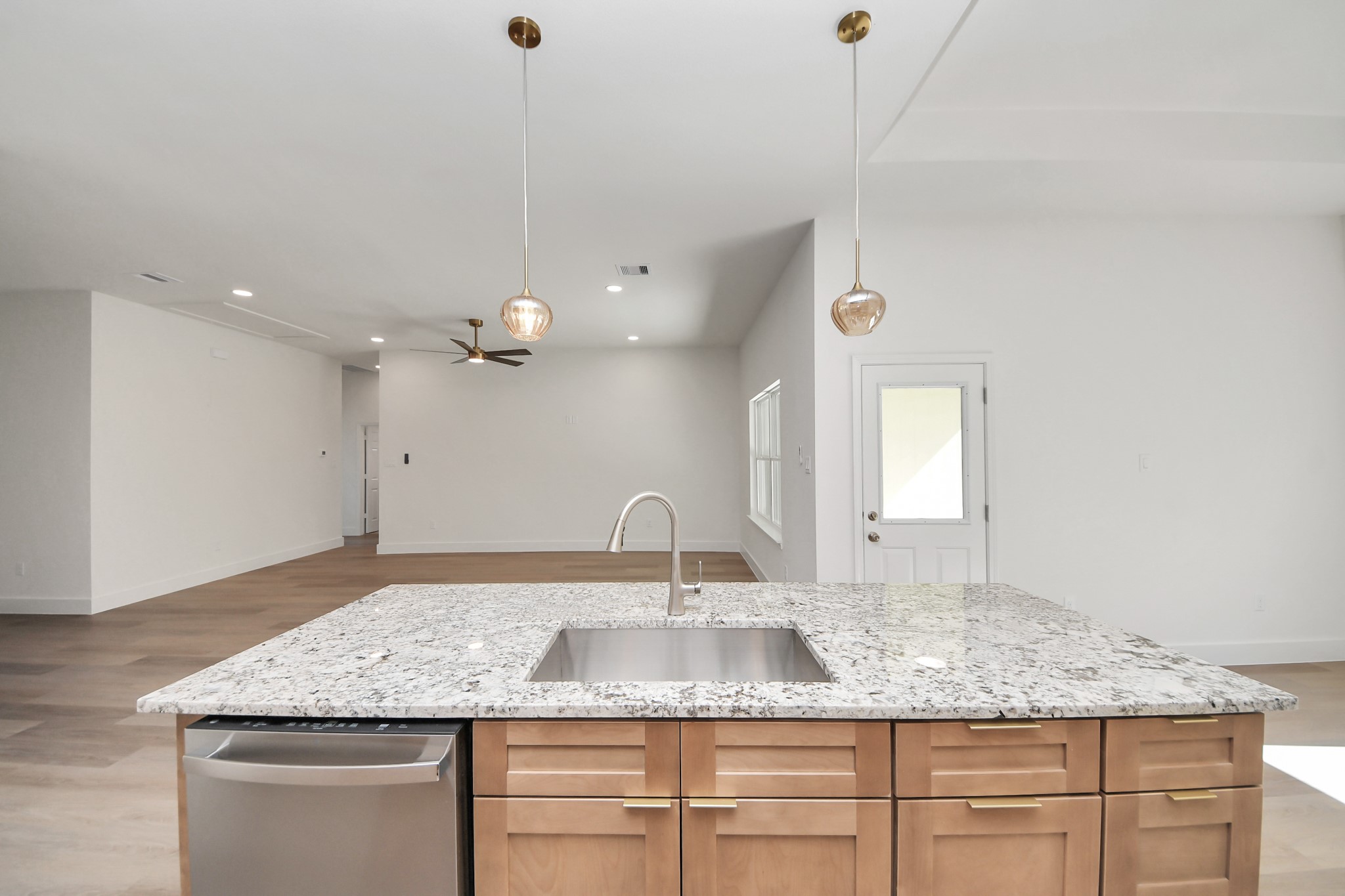 16280 Jeet Street Conroe, TX 77306 - Photo 16 of 44 a bathroom with a granite countertop sink a large mirror and vanity