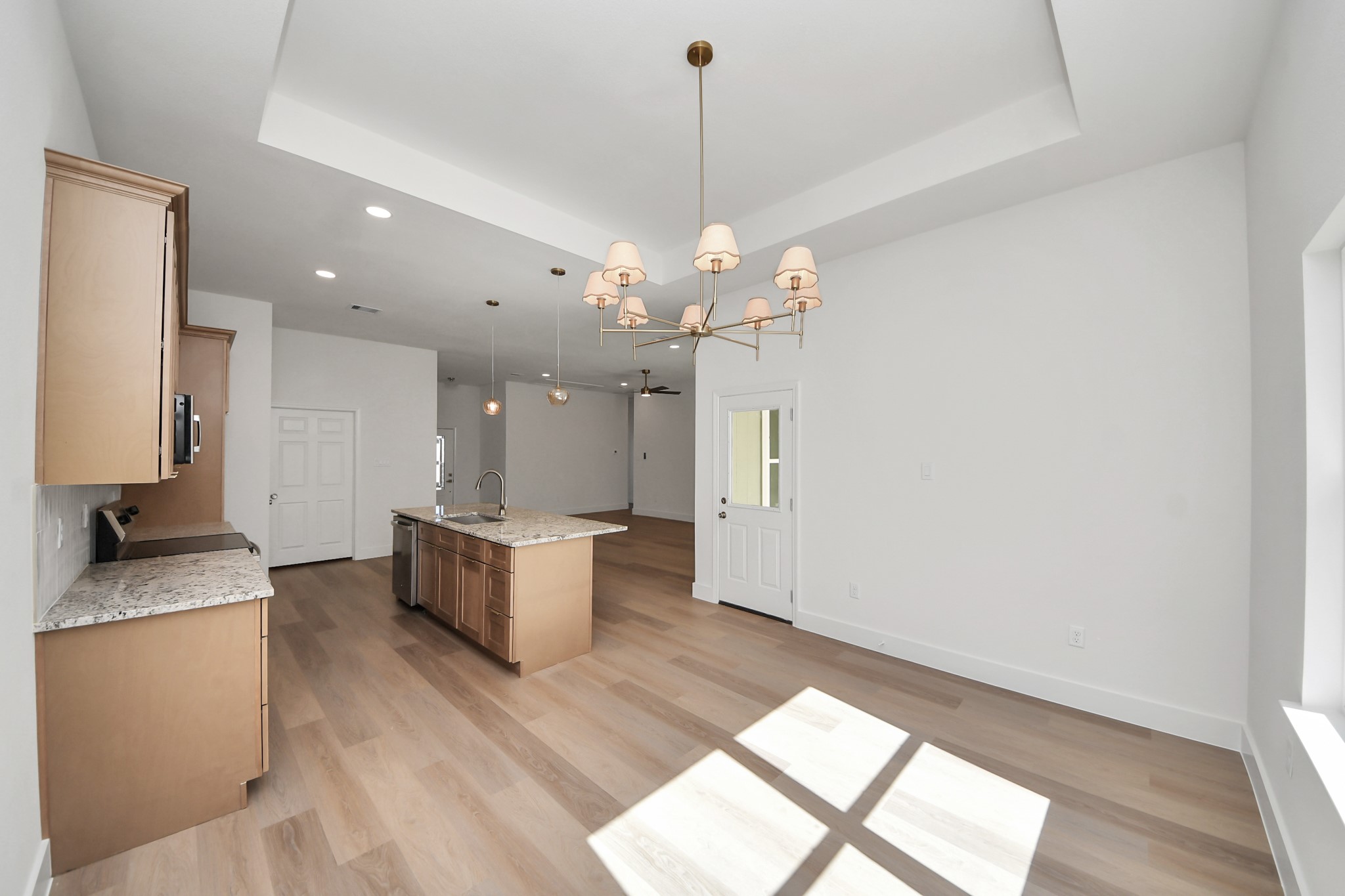 16280 Jeet Street Conroe, TX 77306 - Photo 20 of 44 a dining hall with granite countertop wooden floor