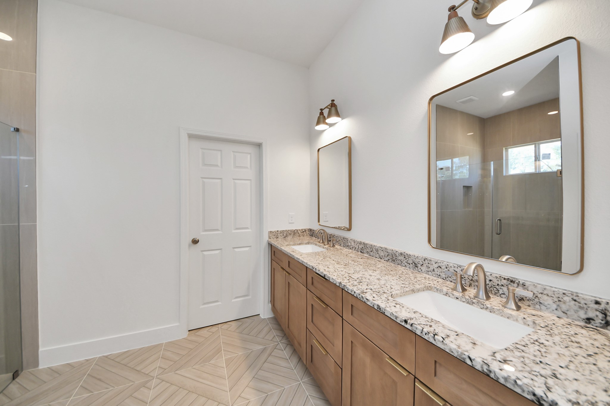 16280 Jeet Street Conroe, TX 77306 - Photo 27 of 44 a bathroom with a granite countertop double vanity sink and a mirror