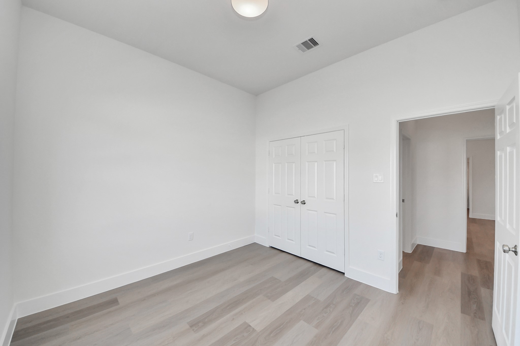 16280 Jeet Street Conroe, TX 77306 - Photo 33 of 44 a view of an empty room and wooden floor