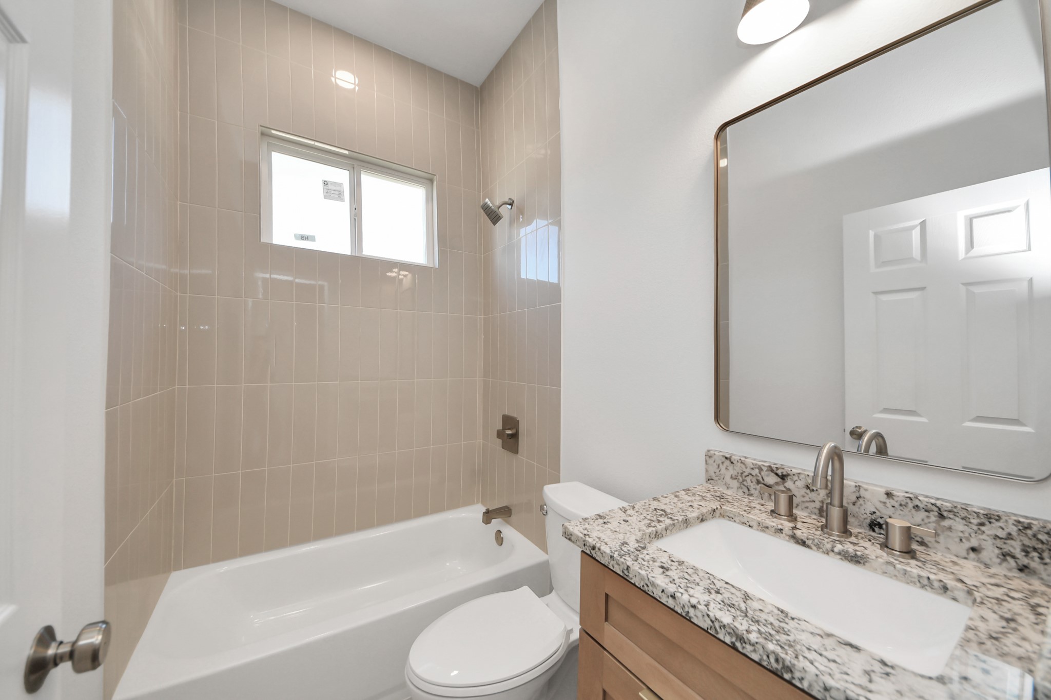 16280 Jeet Street Conroe, TX 77306 - Photo 37 of 44 a bathroom with a granite countertop sink toilet tub and shower